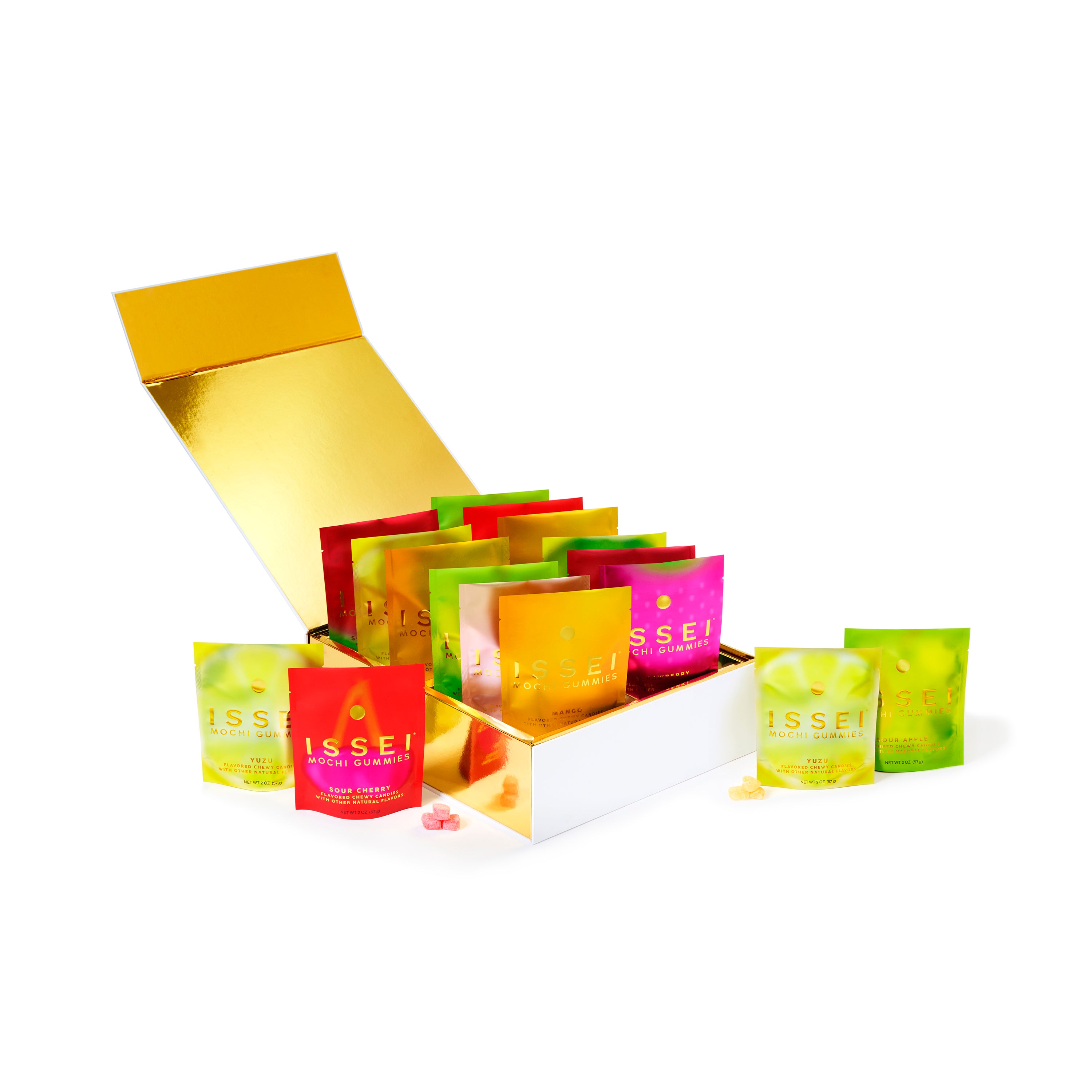 Assorted colorful Issei Mochi Gummies bags in a gold box on a white background