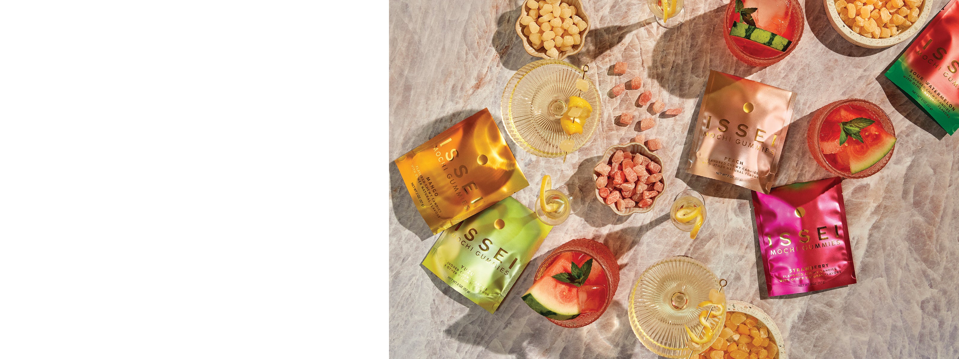 Colorful Issei packaging, mochi gummies candy and drinks on a textured surface