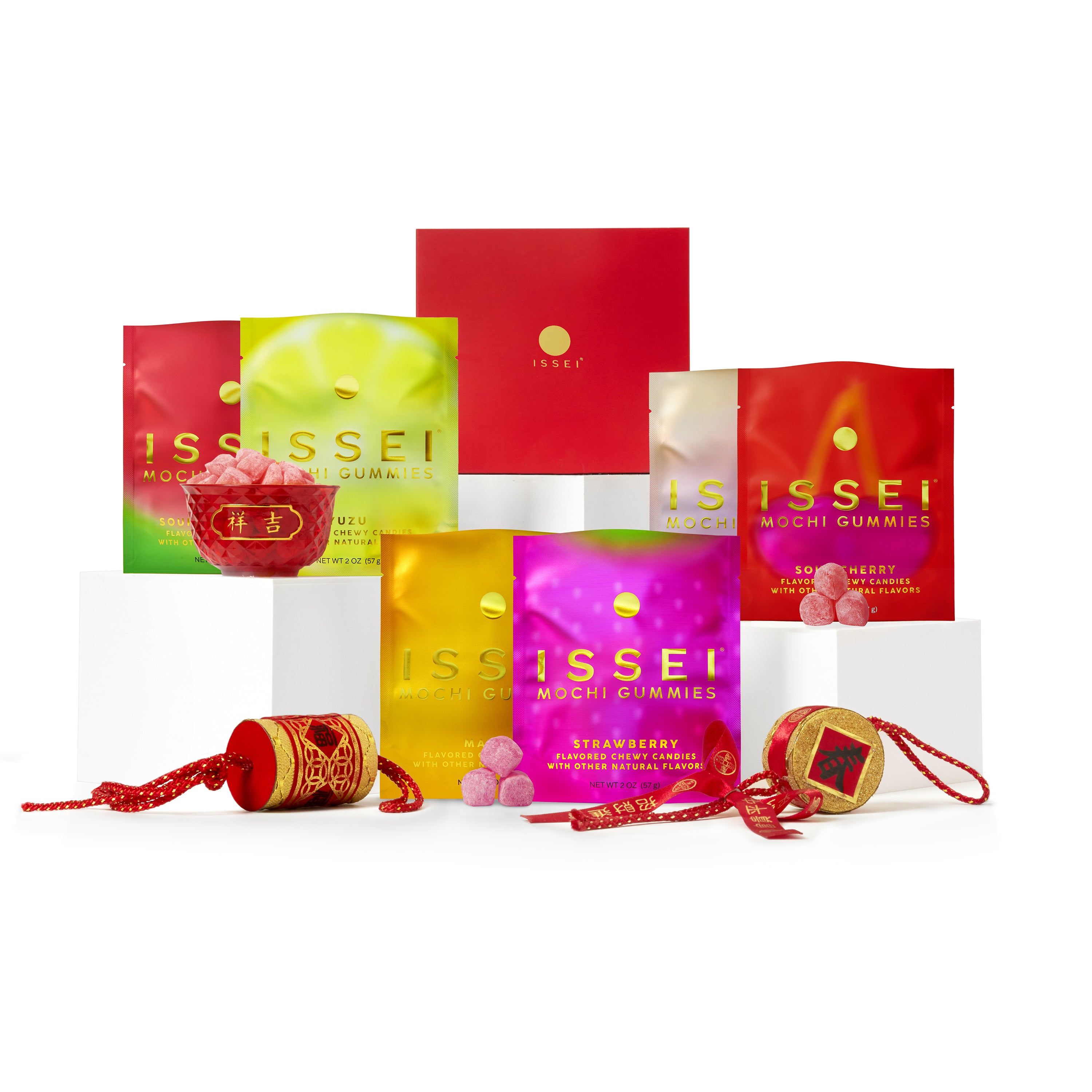 Assorted packages of Issei Mochi Gummies on a white background 